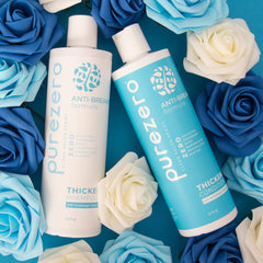 Purezero 24-ounce shampoo and conditioner set on bathroom shelf