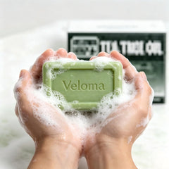 Qbustv Veloma soap in hand during use showing easy application