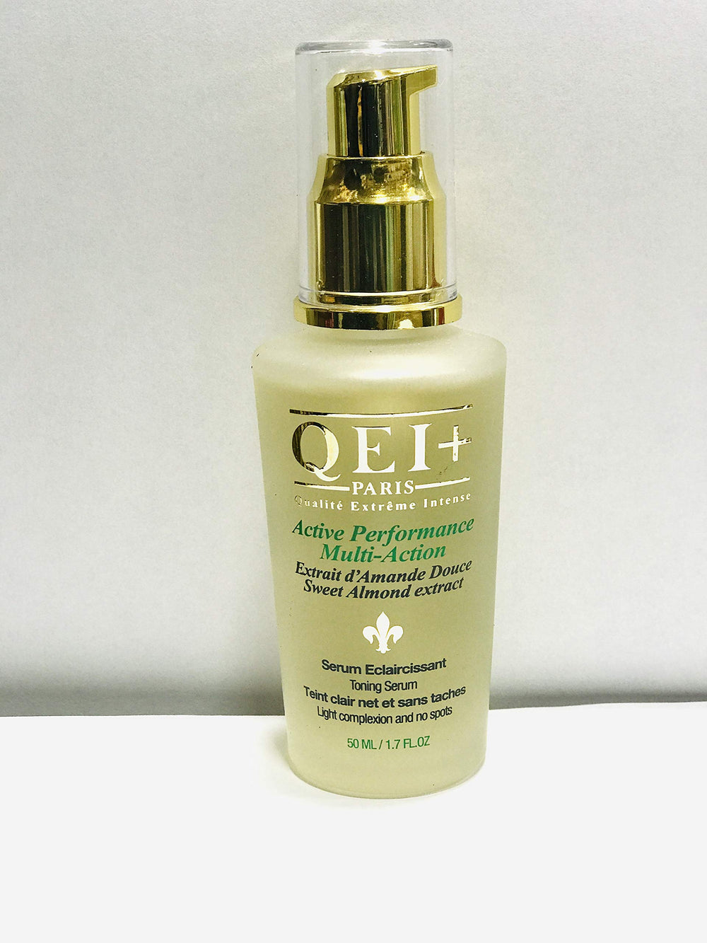 QEI+ PARIS Active Serum bottle front with a tone-enhancing formula for all skin tones.