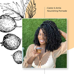 Hands apply Qhemet Biologics Castor and Amla pomade to scalp for conditioning.