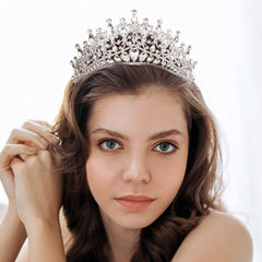 QIAIYALA rhinestone crown elevates wedding photos with timeless shine.