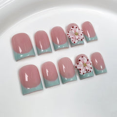 Qicaijia 3D flower press-on nails with rhinestones for a glamorous, ready-to-wear manicure