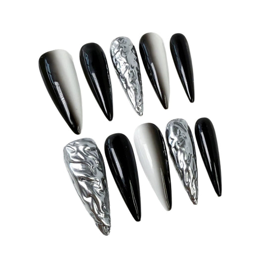 Qicaijia black white ombre stiletto nails for bold evening style.