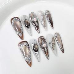 Qicaijia brown cat's-eye full-cover nails with glossy almond finish for daily wear