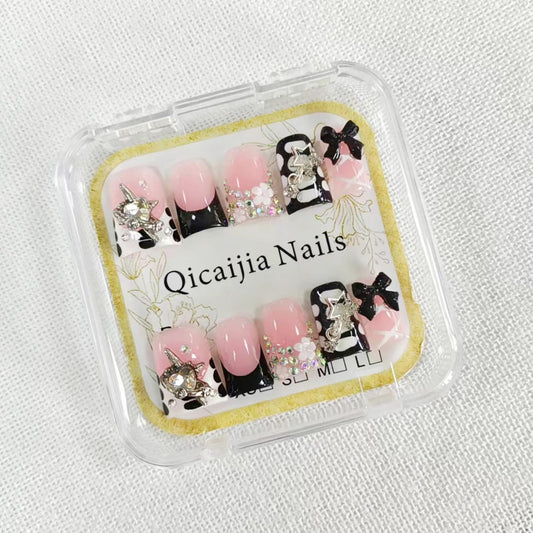 Qicaijia duck press on nails with black French tip for a bold look.