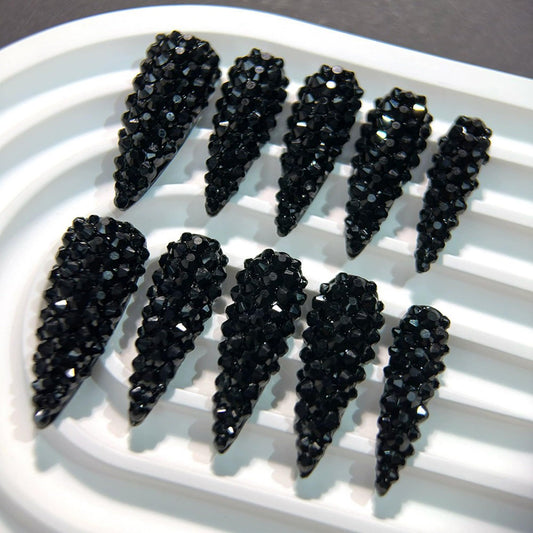 Qicaijia glossy almond nails showcase a 3D design for luxe appeal.