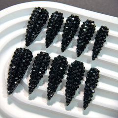 Qicaijia glossy almond nails showcase a 3D design for luxe appeal.