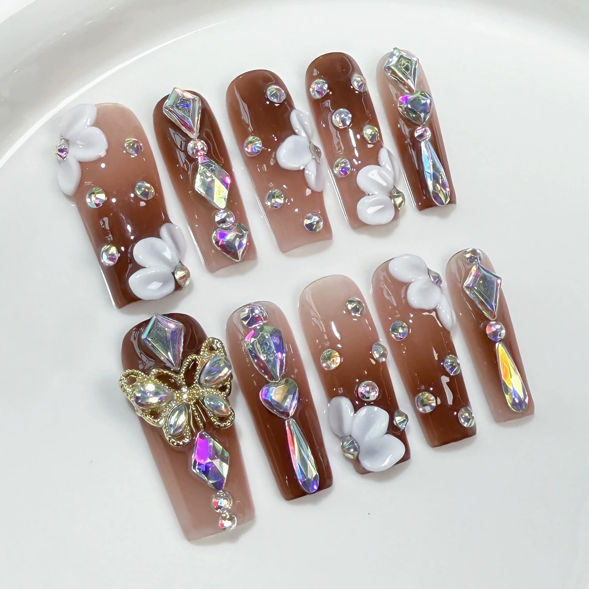 Qicaijia long press nails with 3D butterfly and flower accents for glam manicure