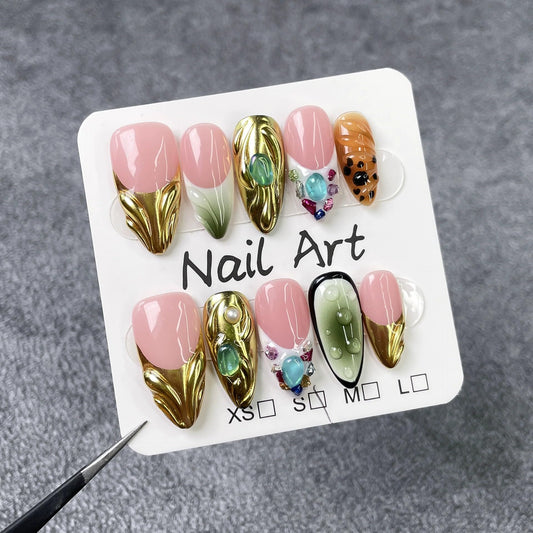 Qicaijia nails with 3D rhinestones and gold shimmer for glamour