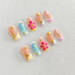 Qicaijia luxury French tip nails with rhinestones for a sophisticated look.