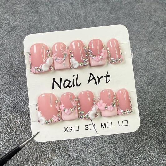 Qicaijia luxury rhinestone accent with pink French tip for glam occasions.