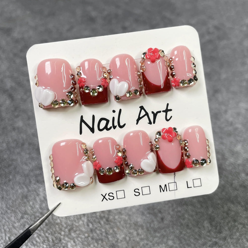 Qicaijia nails with included adhesive glue for quick, salon-like manicure at home.