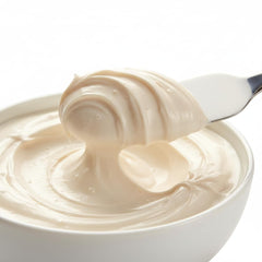 Queen Helene Almond Massage Cream application on hands demonstrates glide and hydration.