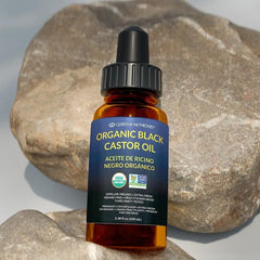 Queen of the Thrones Organic Black Castor Oil packaging on a shelf