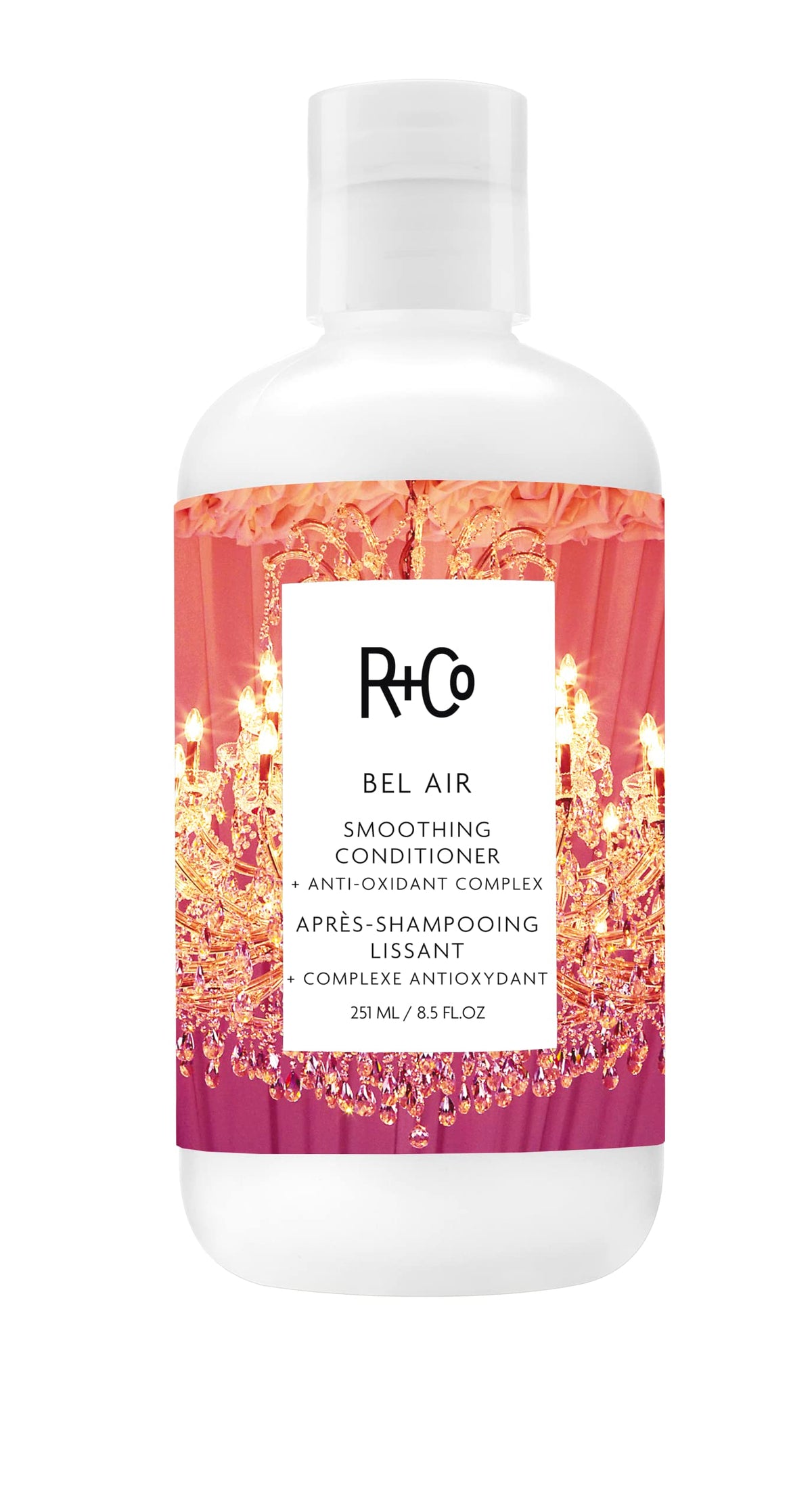 R+Co Bel Air smoothing conditioner bottle angled for frizz control and shine.