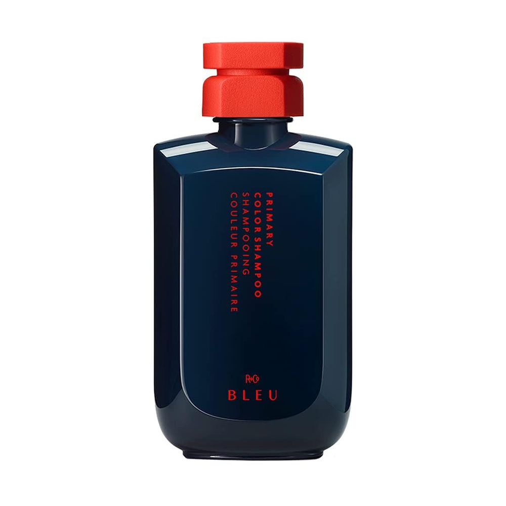 R+Co BLEU Primary Color Shampoo bottle front view highlights color-safe cleansing for color-treated hair.