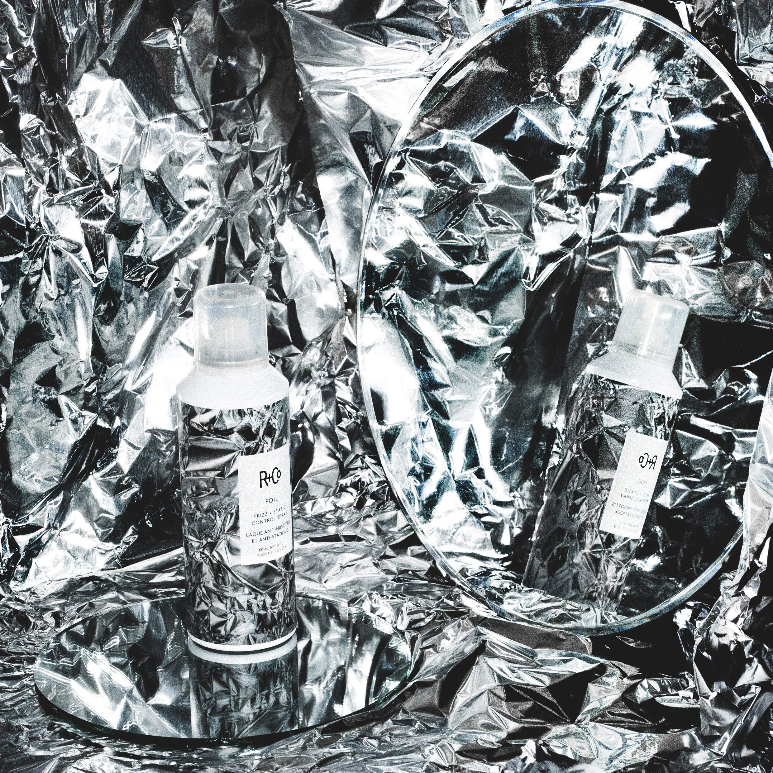 R+Co Foil Frizz + Static Control Spray nozzle shows fine mist for even control.