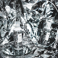 R+Co Foil Frizz + Static Control Spray nozzle shows fine mist for even control.
