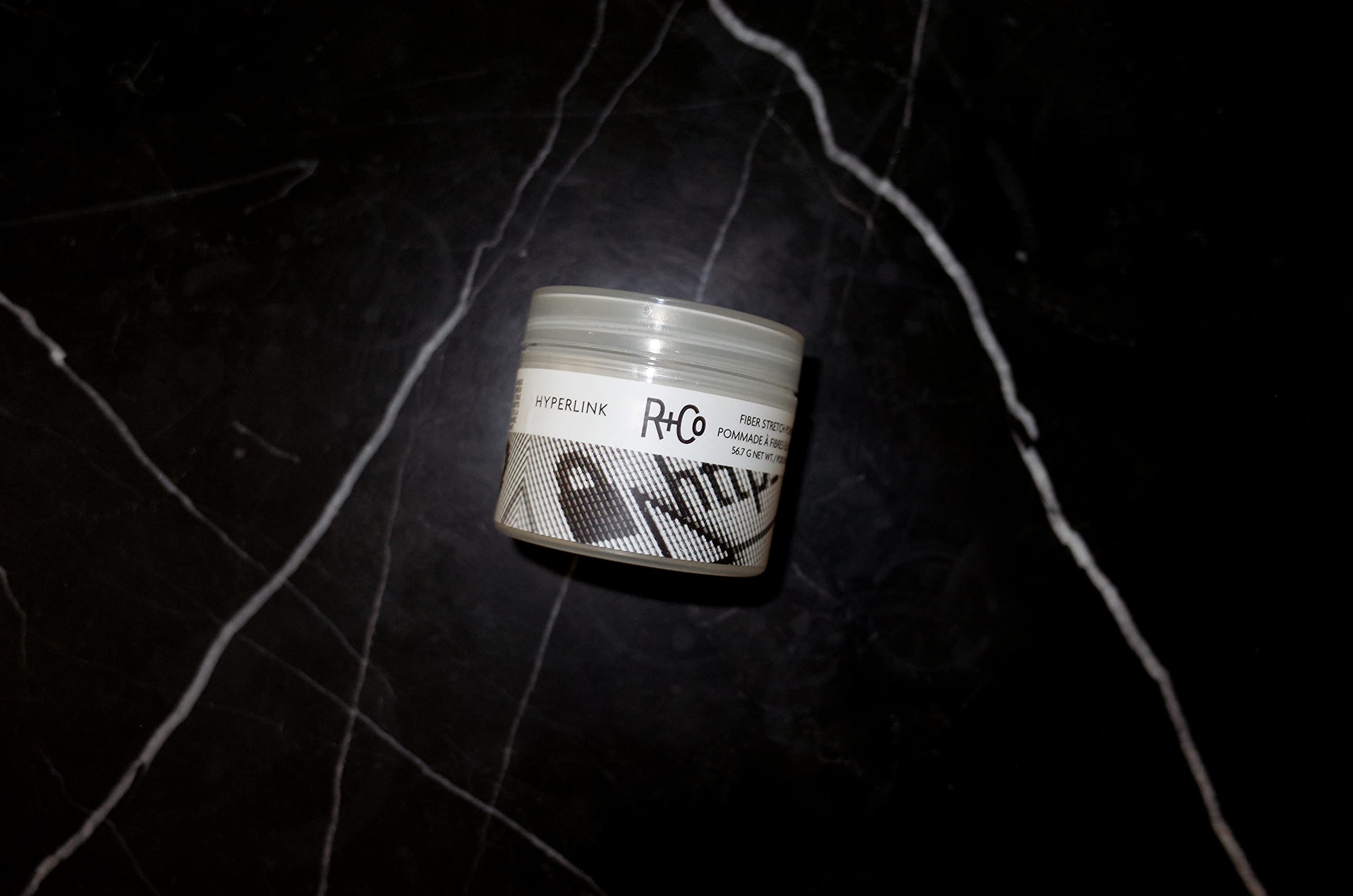 R+Co Hyperlink applied on hair with defined texture and light shine