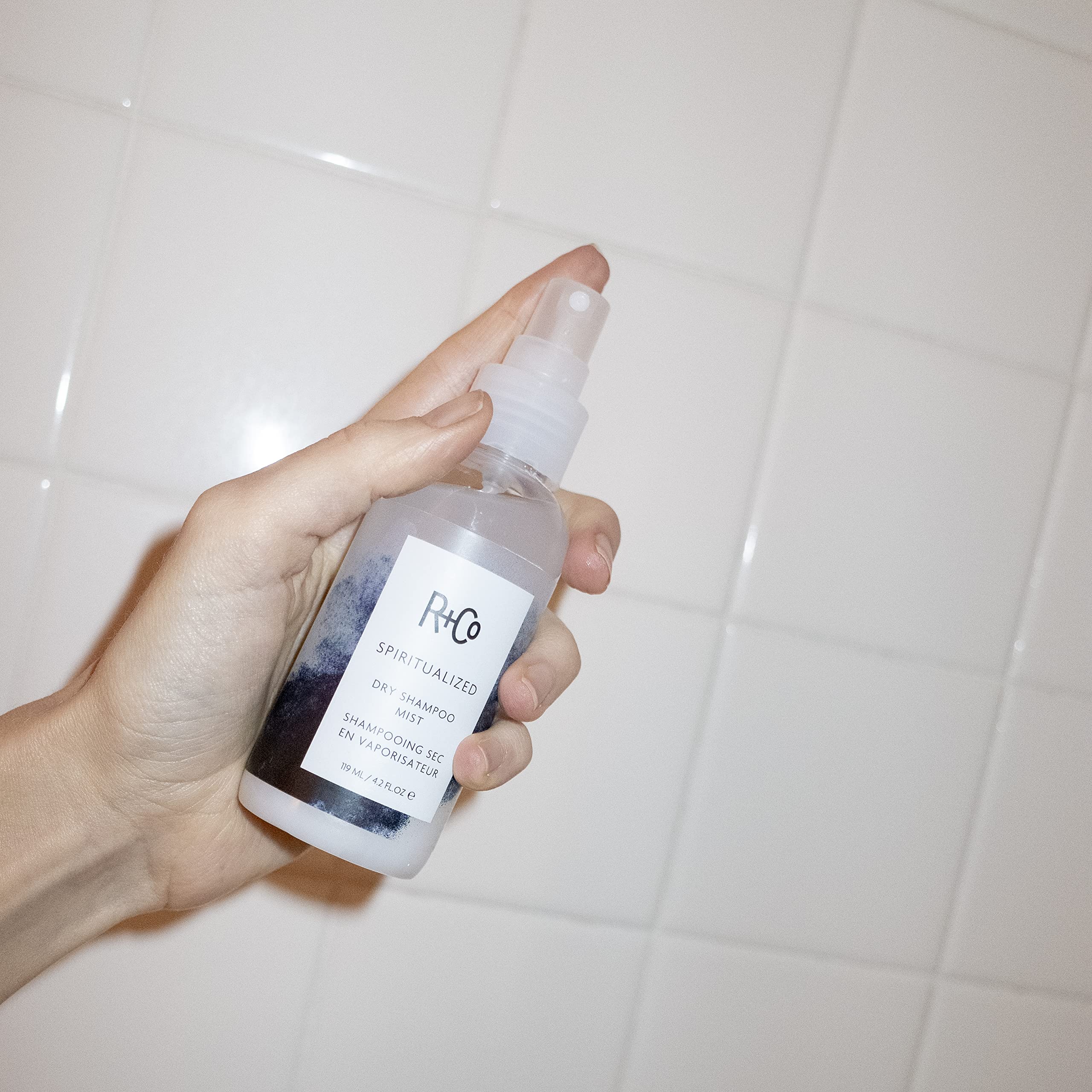 R+Co Spiritualized Dry Shampoo Mist applied to roots helps absorb oil between washes.