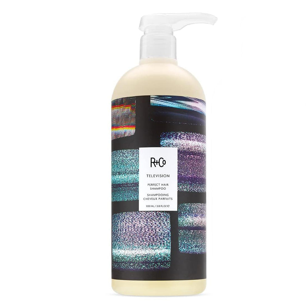 R+Co Television Conditioner bottle close-up, detangling ease and body.