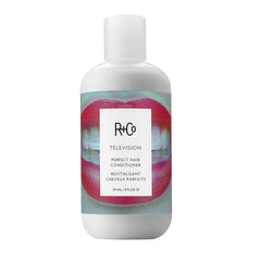 R+Co Television Perfect Hair Conditioner bottle close-up showing smooth, hydrated hair