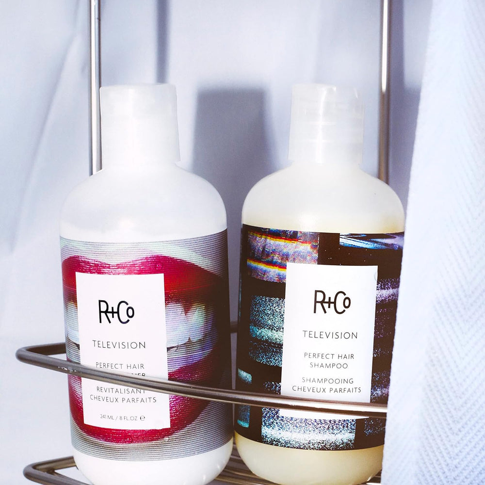 R+Co Television Shampoo lather on wet hair demonstrates cleansing action and refreshment.