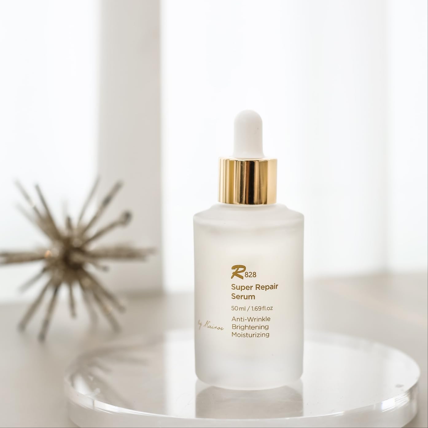 R828 Super Repair Serum bottle close-up showing deep hydration and barrier support.