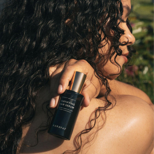 RANAVAT BOTANICS Mighty Majesty serum drop highlighting luxurious hair oil texture.