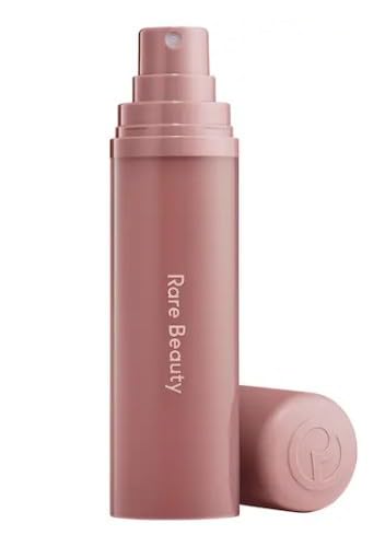 Rare Beauty Find Comfort Fragrance Mist bottle showcases warm woods aroma for hydrating skin and hair