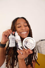 Close-up of Rasttafari Rosewater and Mint Conditioning Spray mist on locs.