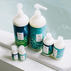 R+Co Atlantis bottle label highlights B5 and moisture-boosting benefits.