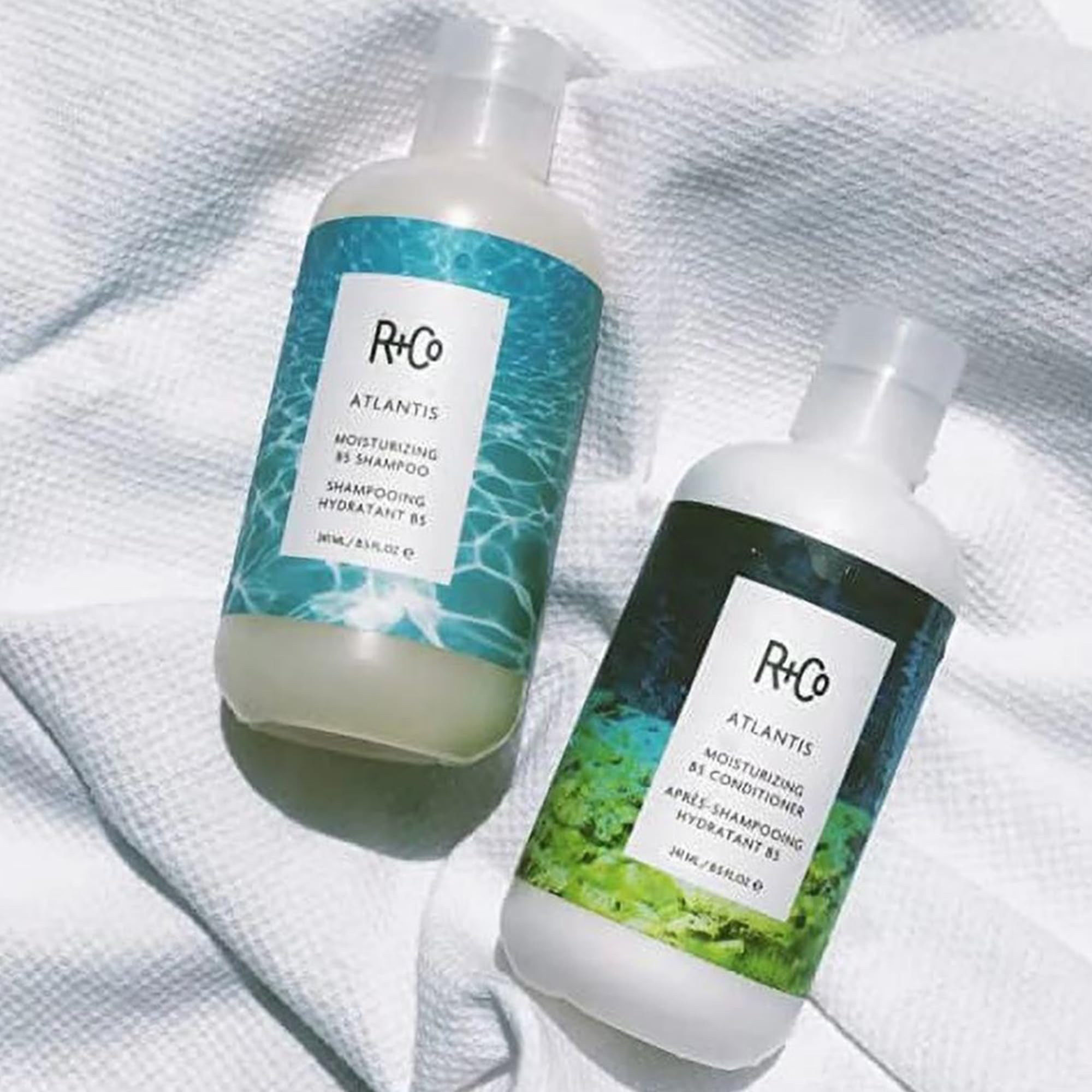 R+Co Atlantis 1000ml bottle showcases salon-grade care at home.