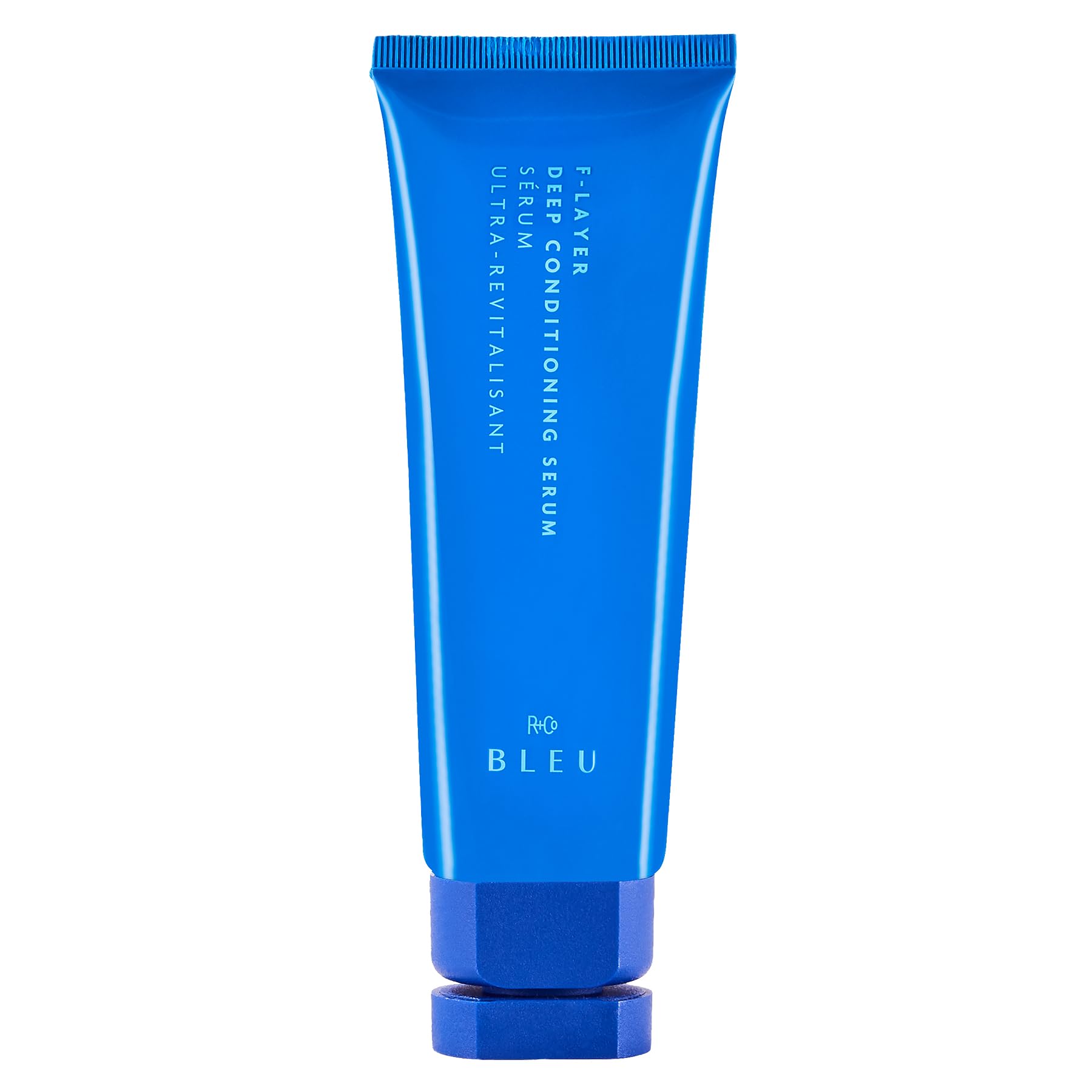 R+Co BLEU F-Layer bottle close-up showing weightless hydration.