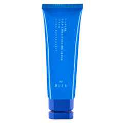 R+Co BLEU F-Layer bottle close-up showing weightless hydration.