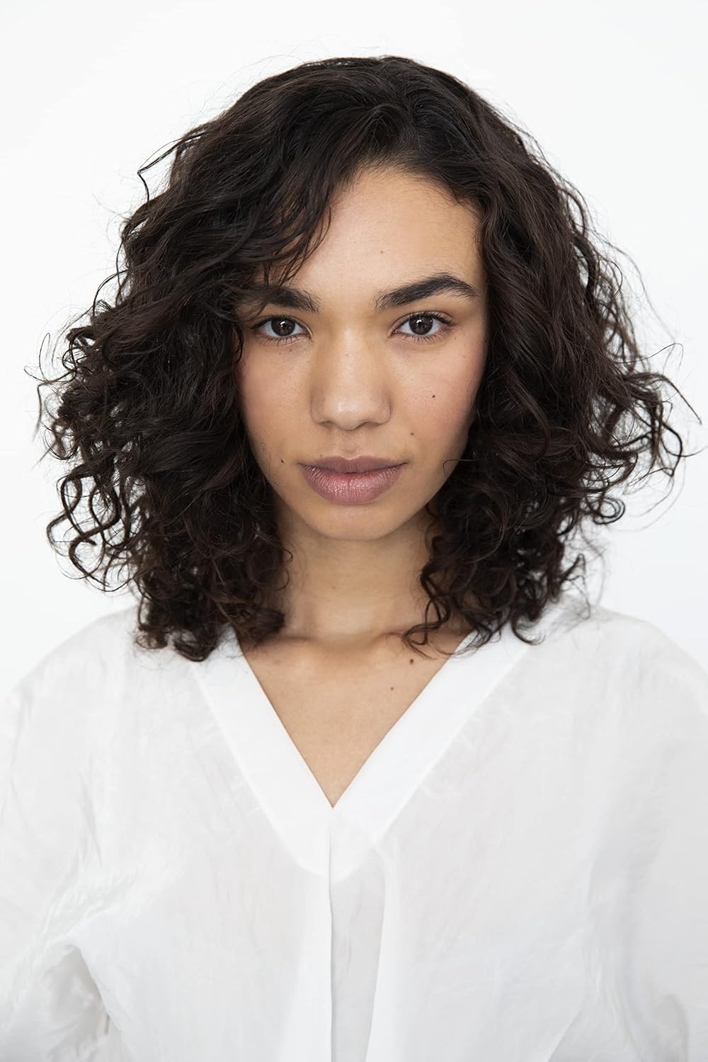 Styled curls on model demonstrate defined, frizz-free finish from the Cassette set.