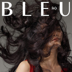 R+Co Magnifier Thickening Spray bottle featuring biotin and pea protein benefits for stronger, thicker hair.