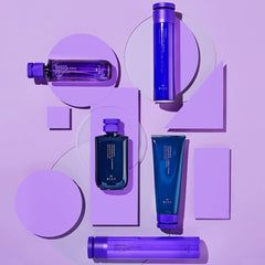 R+Co Magnifier Thickening Spray mist applied to hair during styling for added volume.