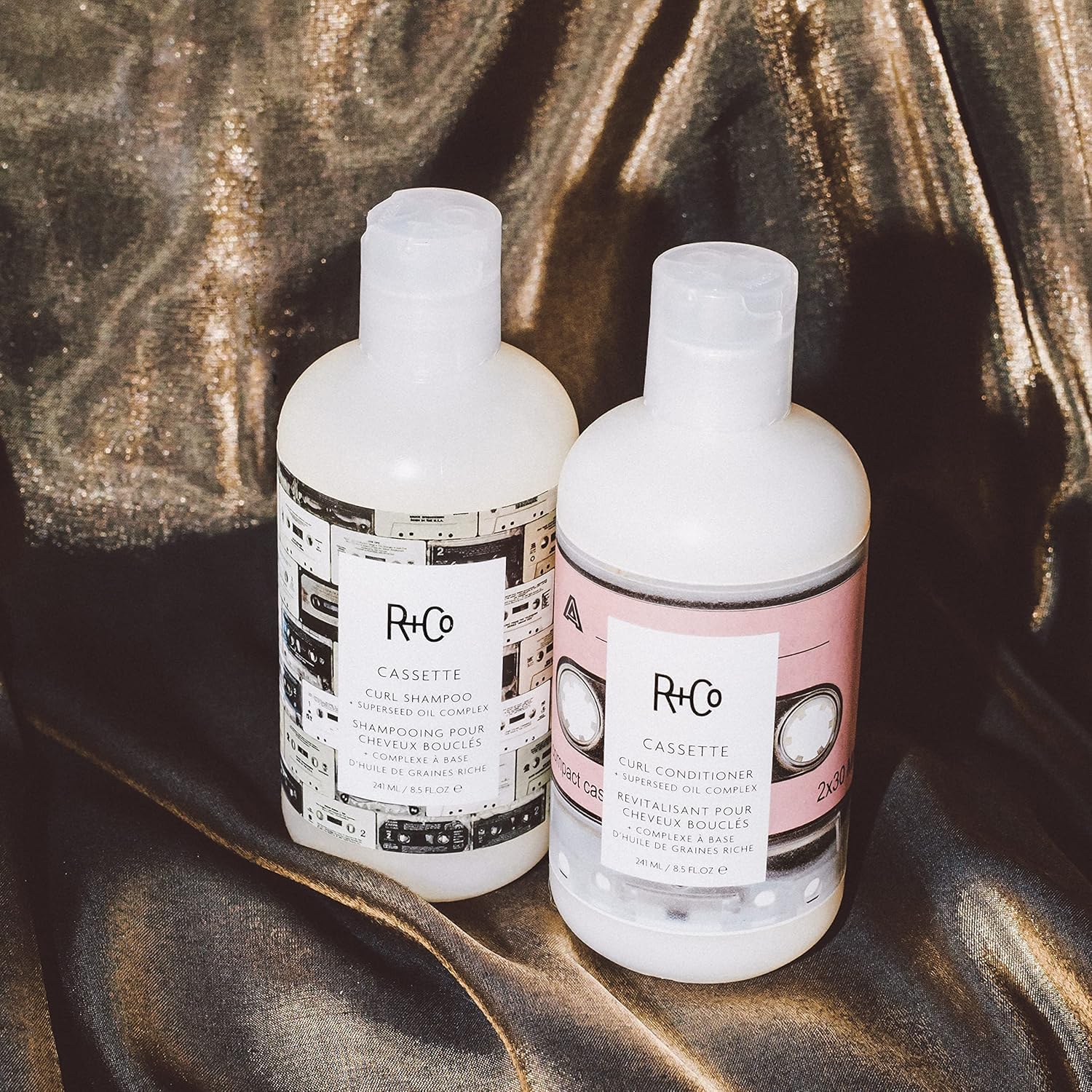 R+Co Superseed Oil Complex bottle highlighting nourishment and added shine for curls.