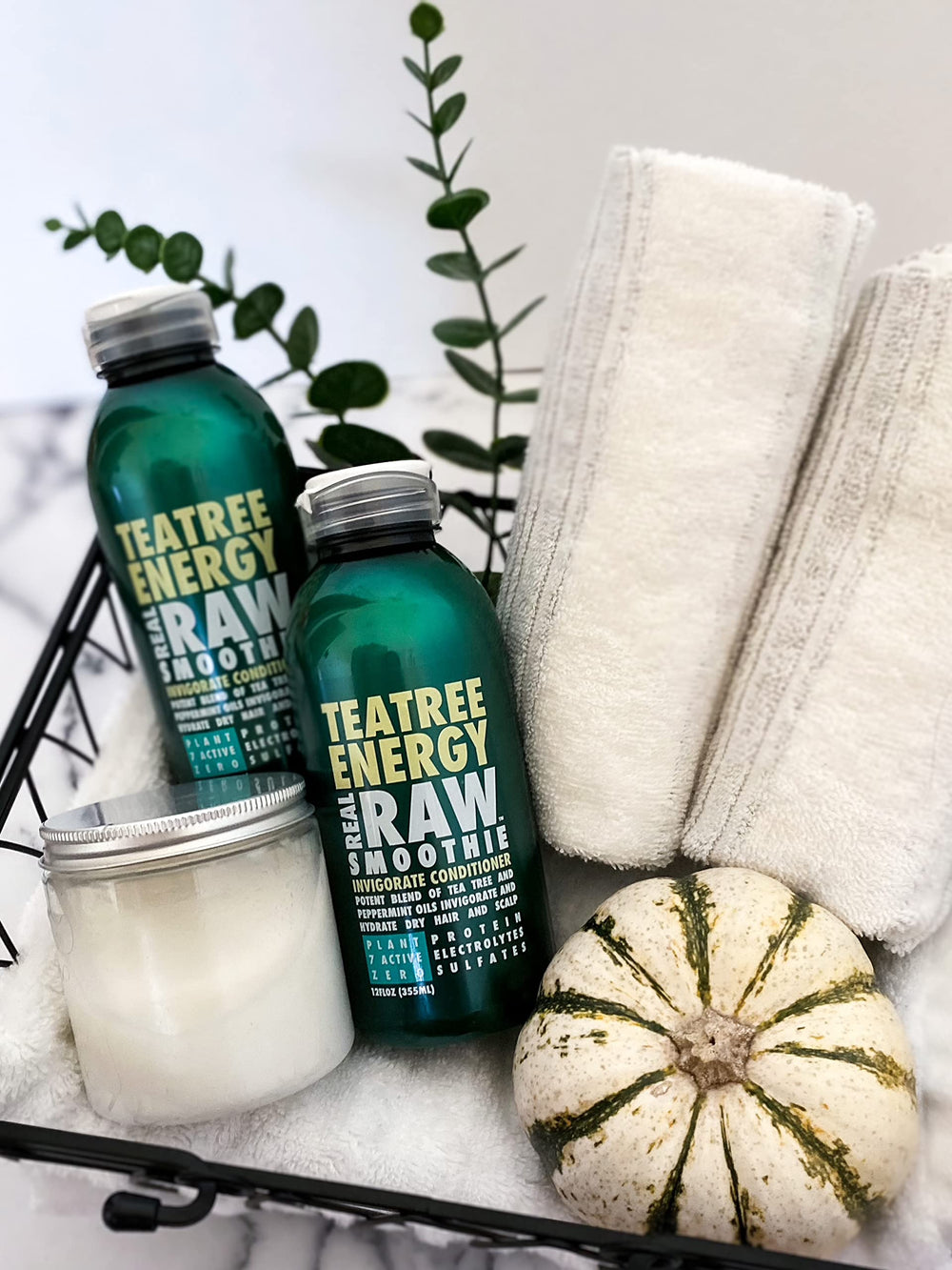 Real Raw Tea Tree shampoo-conditioner on shower shelf for daily use