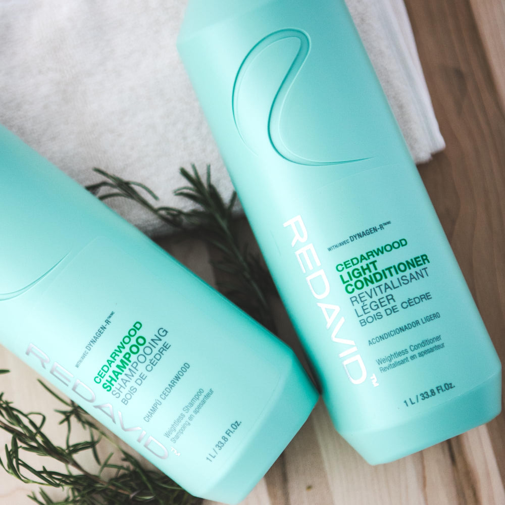 Lathered Redavid Cedarwood Shampoo on hair in shower showing added volume and body.