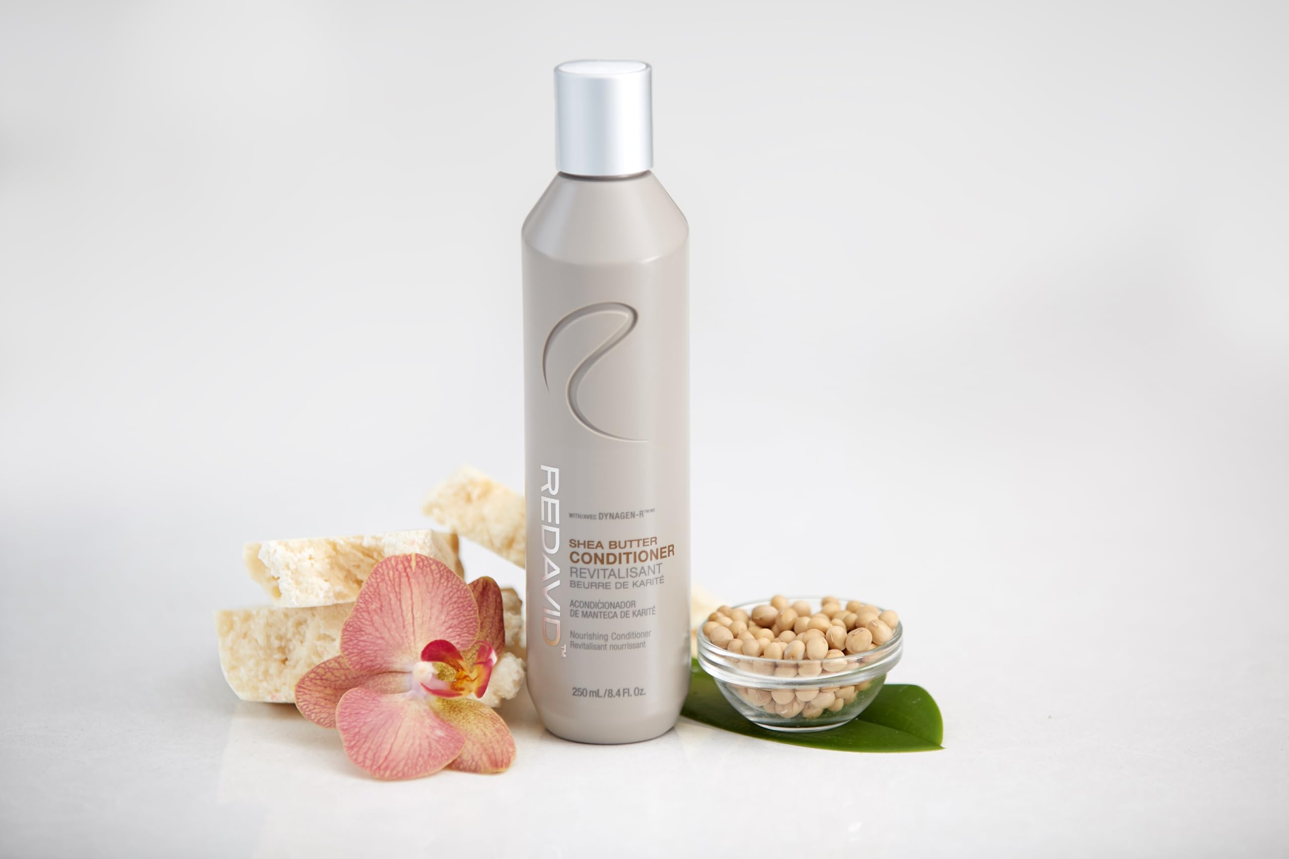 Redavid conditioner being poured, showing smooth glide for detangling.