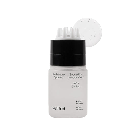 Refilled Booster Plus Moisture bottle with built-in massager for easy scalp care and fast absorption.