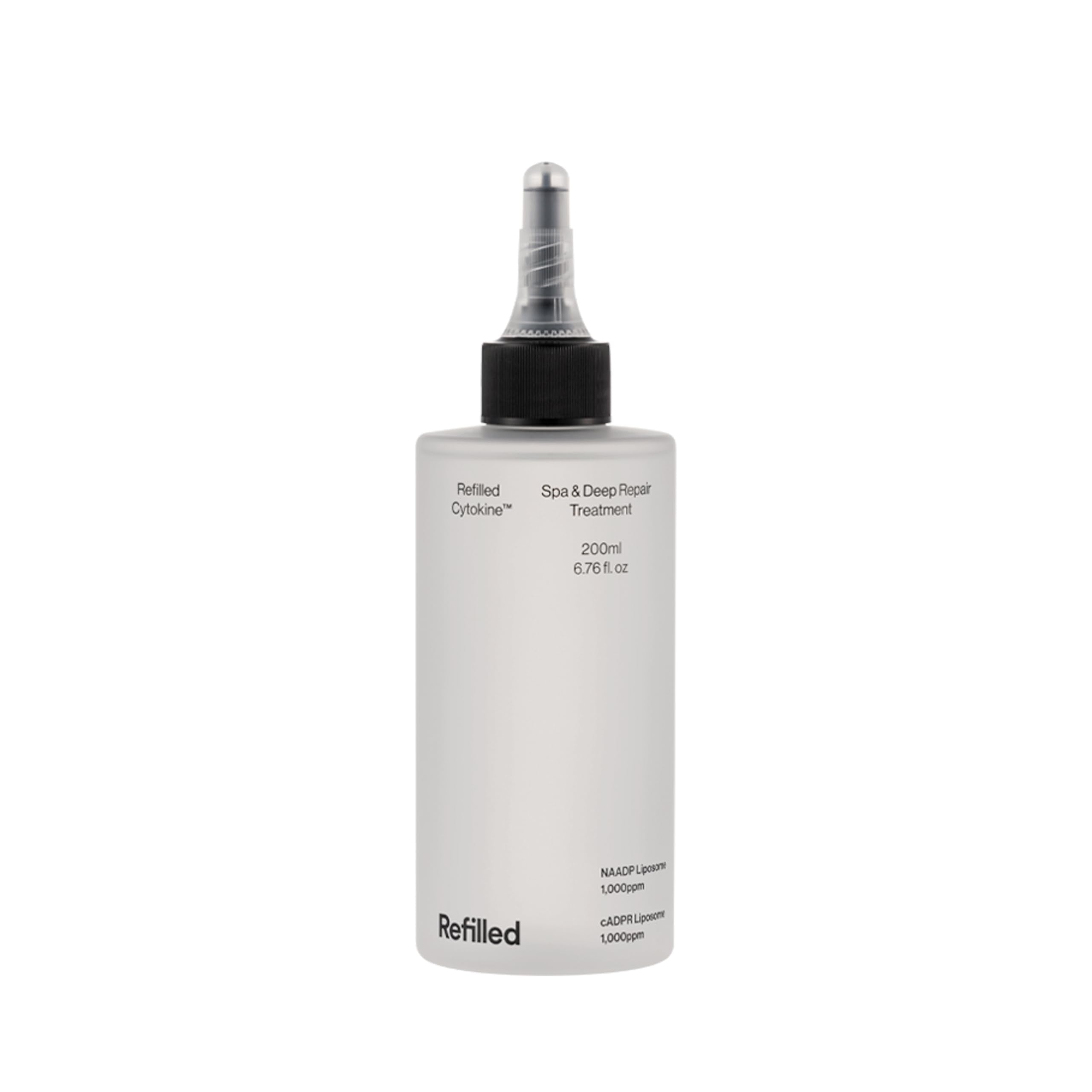 Refilled Cytokine Spa bottle close-up delivering deep hydration for stressed hair
