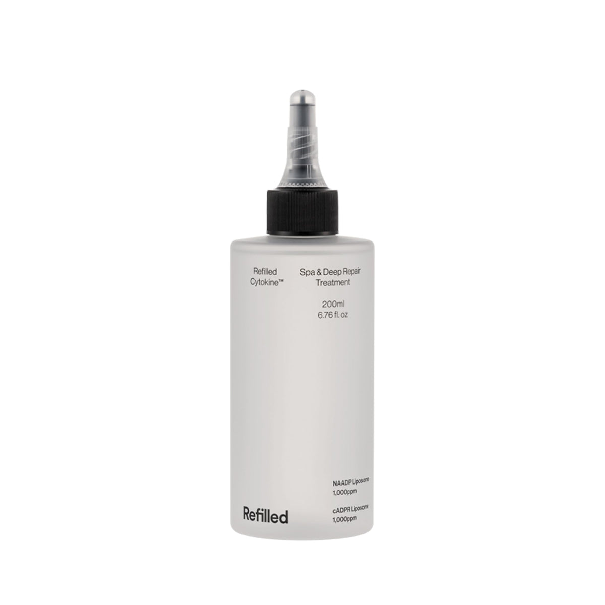 Refilled Cytokine Spa bottle close-up delivering deep hydration for stressed hair