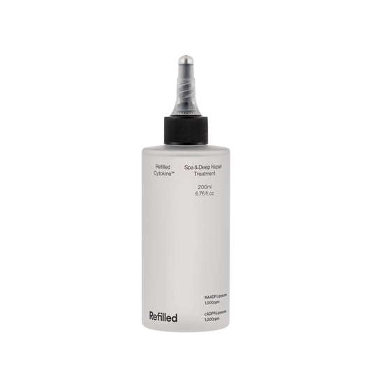 Refilled Cytokine Spa bottle close-up delivering deep hydration for stressed hair