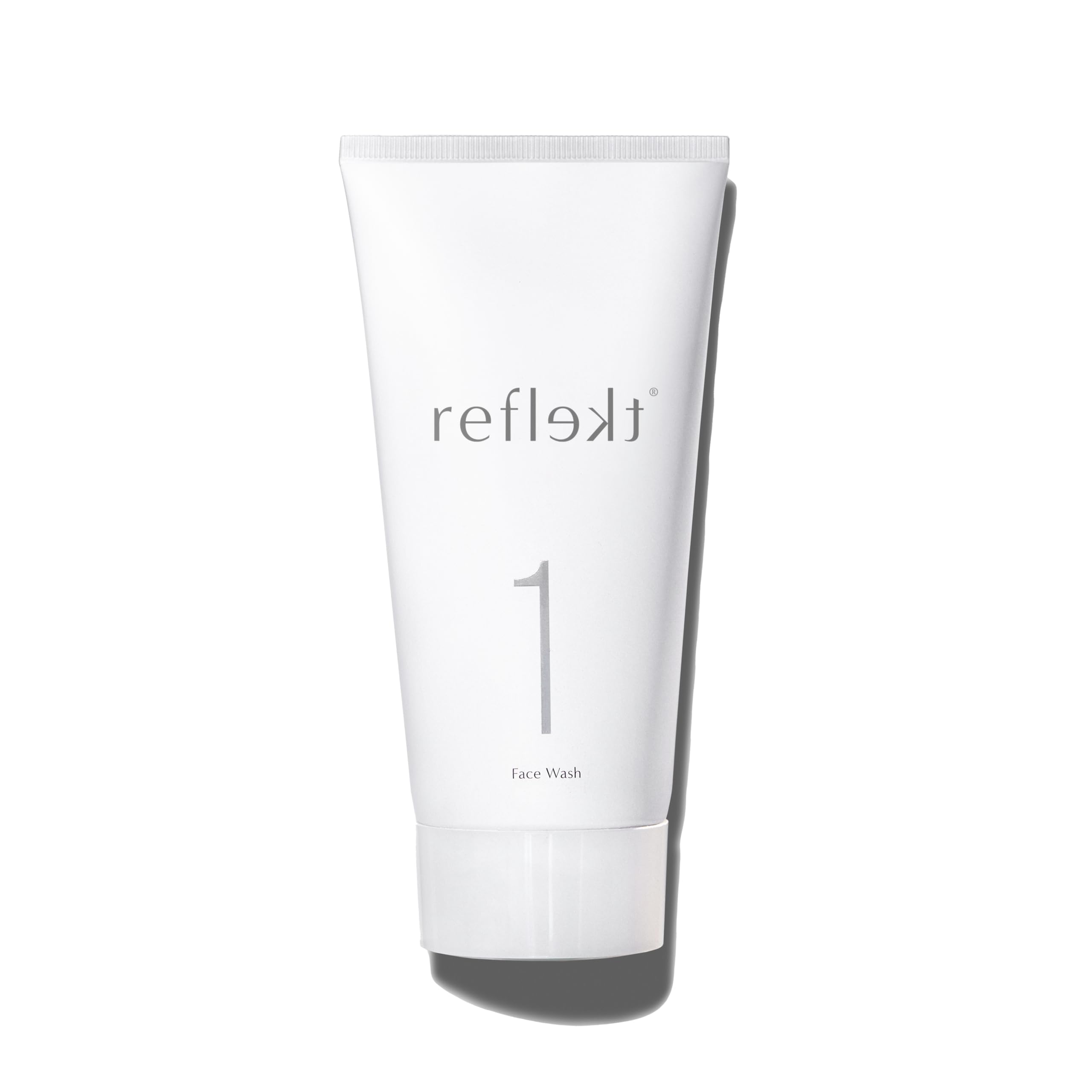 REFLEKT 1 daily exfoliating face wash bottle demonstrates gentle cleansing for clear pores.
