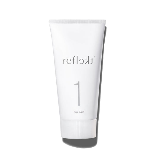 REFLEKT 1 daily exfoliating face wash bottle demonstrates gentle cleansing for clear pores.