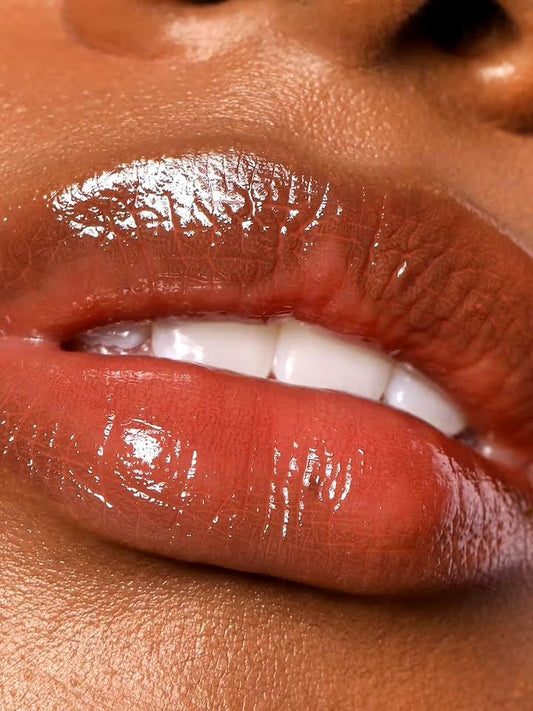 REFY Lip Gloss Dusk swatch on lips showing rich mahogany pink color