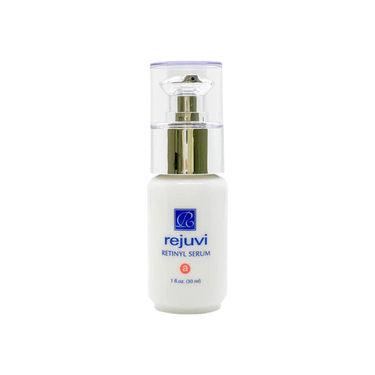 Rejuvi Retinyl Serum bottle close-up for a premium nighttime skincare ritual.